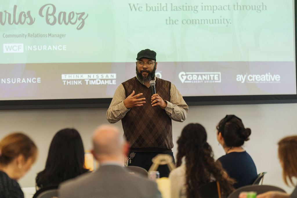 Carlos Baez of WCF Insurance welcoming the audience